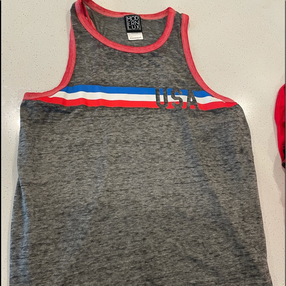 Cute tank.  Kind of shear so wear tank under.  Size L